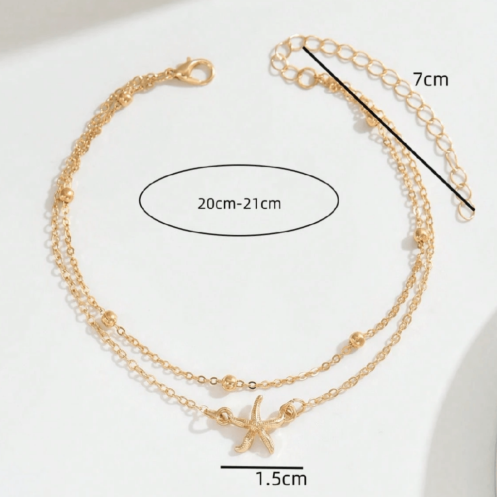 Gold anklets with starfish charms and measurement details on a white background