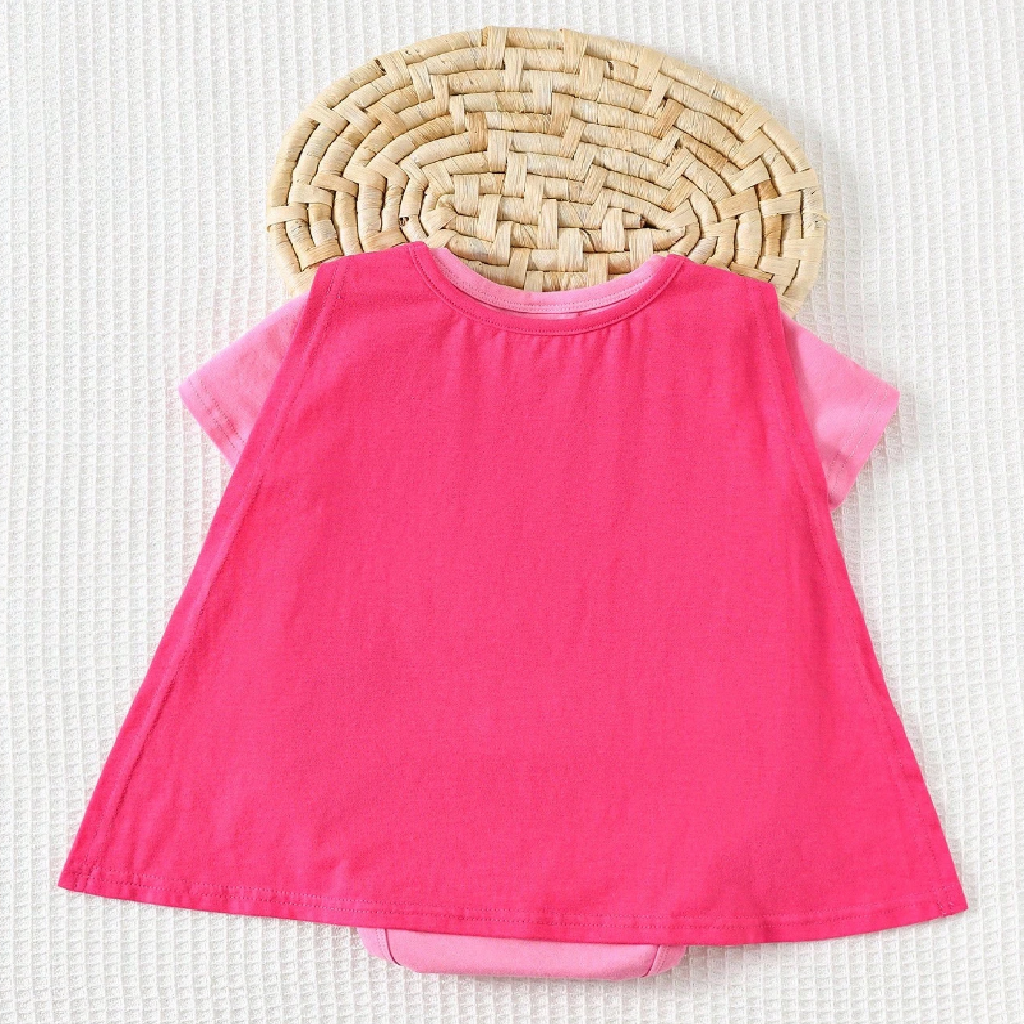 Pink dress with sheer sleeves on a textured white background