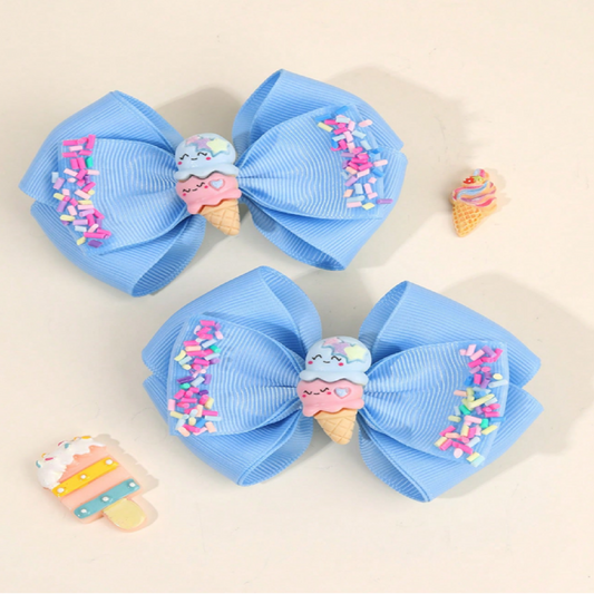 Two large blue bows with ice cream cone decorations