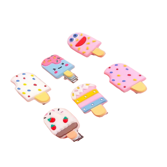 Hand holding colorful ice cream-shaped hair clips