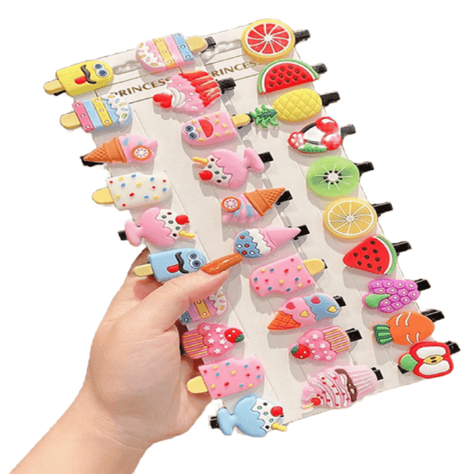 Colorful fruit and ice cream clip set held by a hand on a white background