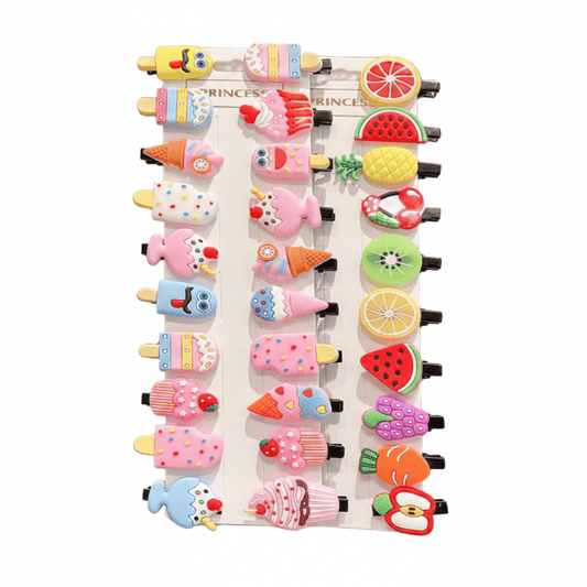 Set of colorful hair clips shaped like ice cream cones, fruits, and other desserts on a white background.