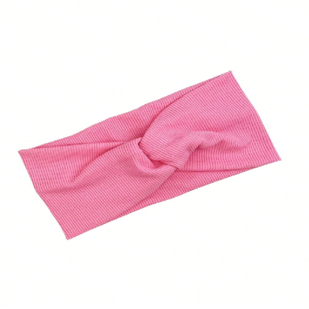 Pink headband with a bow on a white background