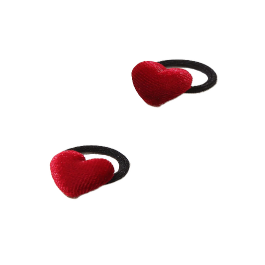 Two red heart-shaped hair ties 
