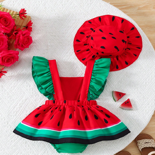 Watermelon-themed children's outfit with hat on a white surface with flowers.