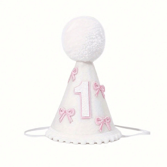 White party hat with pink bows and number '1' on a white background