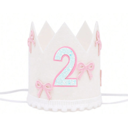 White birthday crown with pink number '2' and bows on a white background