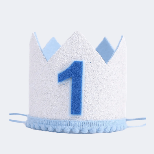 White birthday crown with blue number '1' on a light gray background