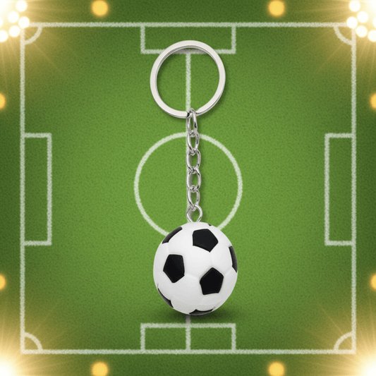 Soccer ball keychain on a green field background