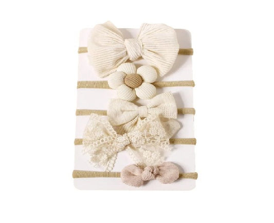 Set of decorative bows and flowers on a striped background