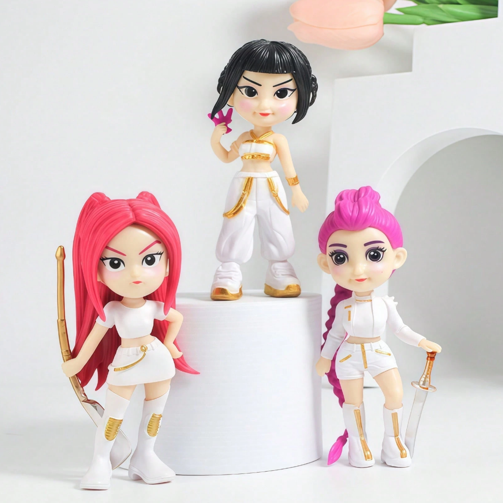 Three dolls with different hairstyles and outfits on a white background