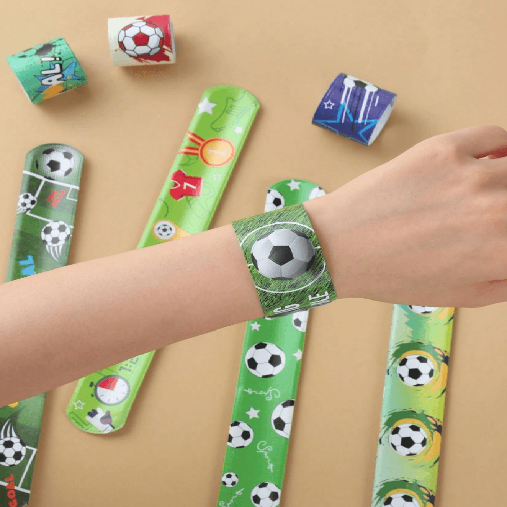 Collection of colorful slap bracelets with sports-themed designs on a white background